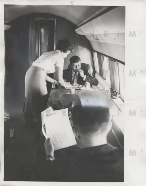 John F. Kennedy Grabs a Bite on the Plane During 1960 Presidential Campaign - Original Photo