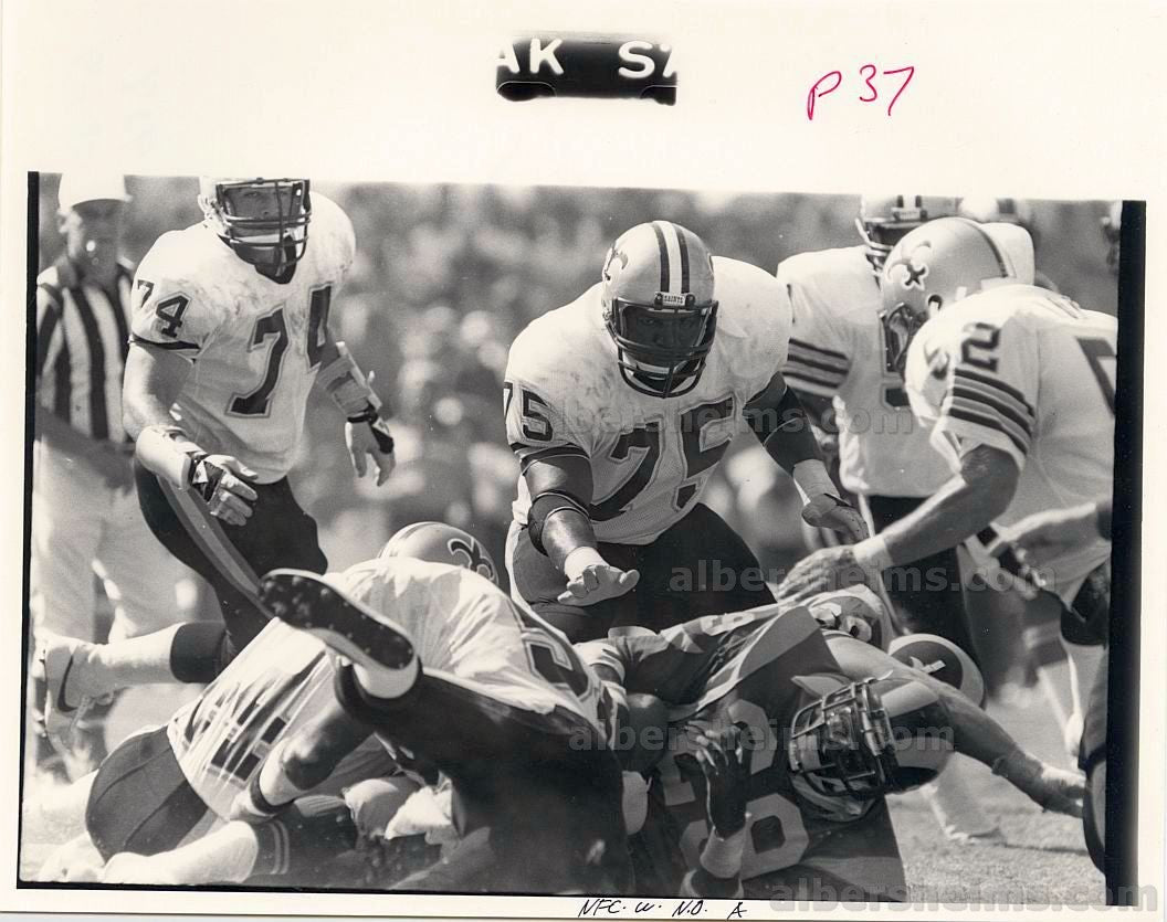 Eric Dickerson Rookie Era Taken down by Bruce Clark New Orleans Saints TYPE I original photo