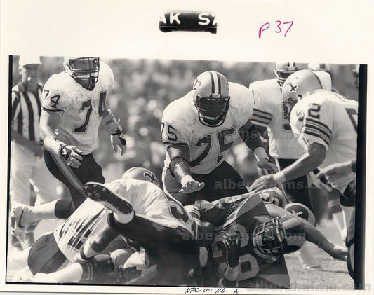 Eric Dickerson Rookie Era Taken down by Bruce Clark New Orleans Saints TYPE I original photo