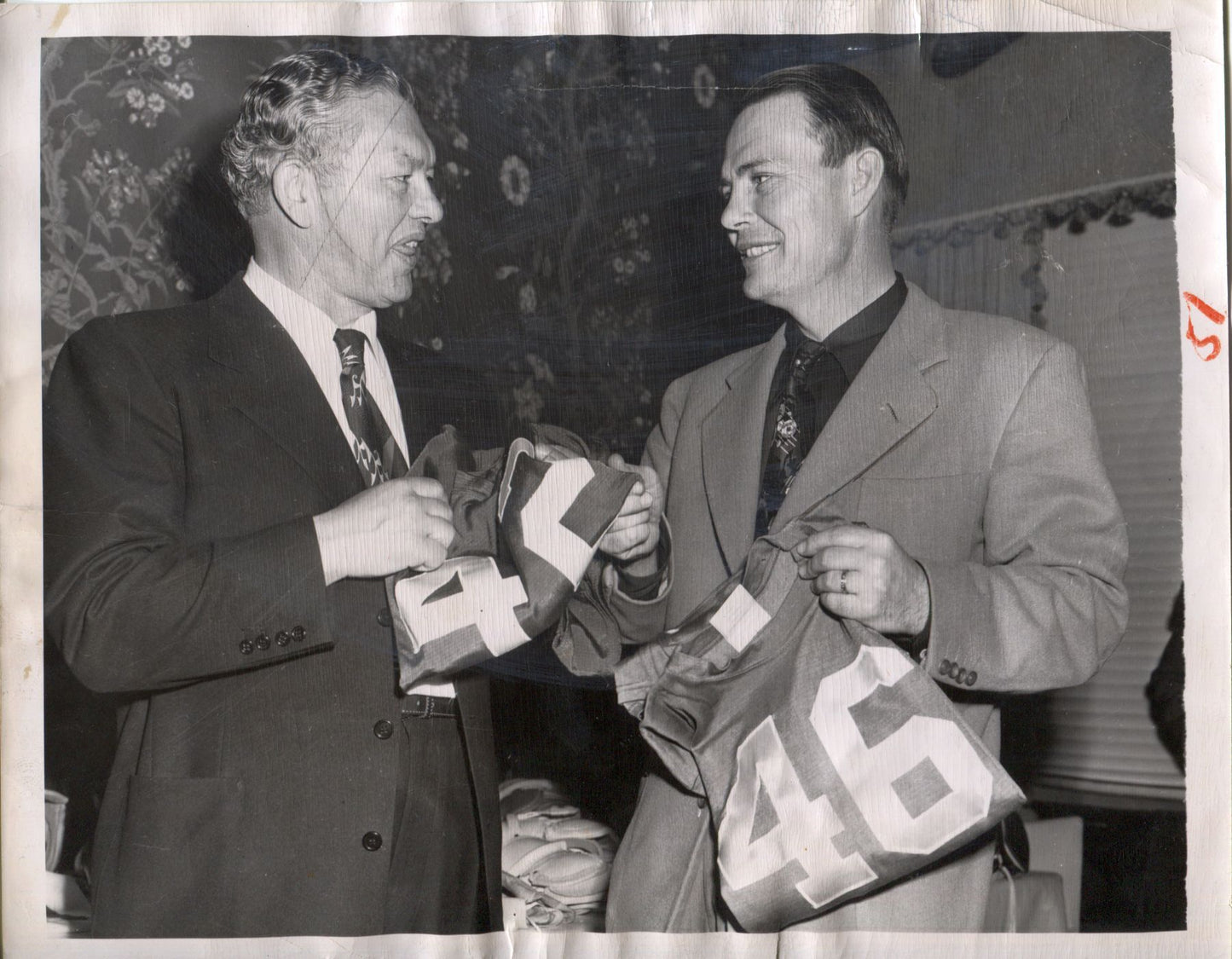Curly Lambeau & Coach Buddy Parker Looking at Jerseys original 1952 photo